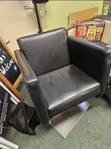 Leather salon arm chairs.